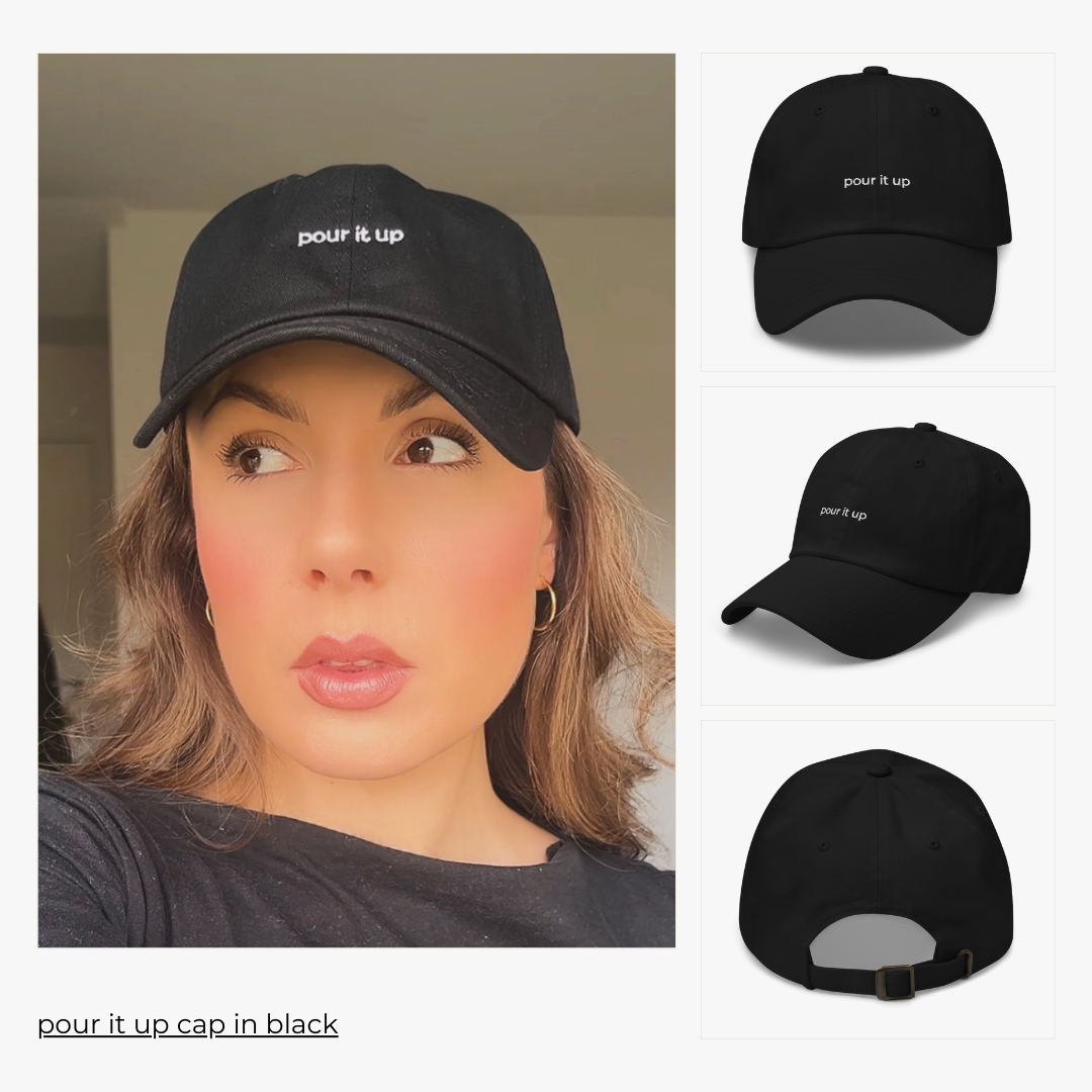 model wears the 'pour it up, cap in black