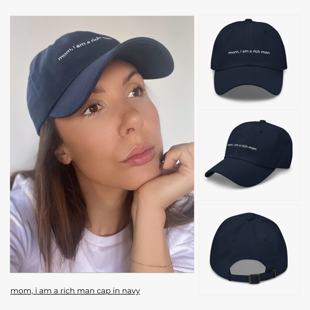 model wears the 'mom, i am a rich man' cap in navy