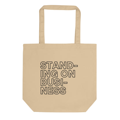 durable tote bag in stone with printed ‘standing on business’ slogan